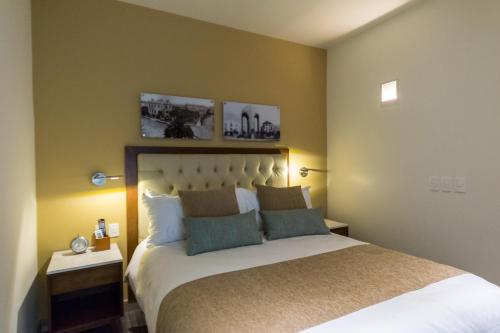 Llit o llits en una habitació de Casa Malí by Dominion Boutique Hotel