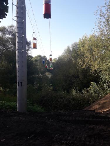 a ski lift with two cars on a pole at Apartment 30 m2 on Sergei Esenin 11 in Kharkiv