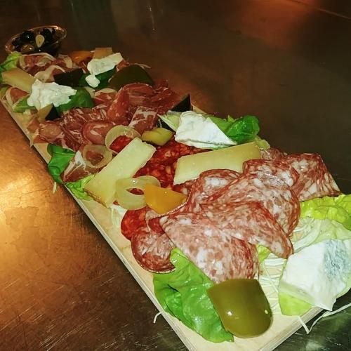 a tray of cheese and other foods on a table at Buongustaio1 Zimmer mit ensuite T&B in Morschach