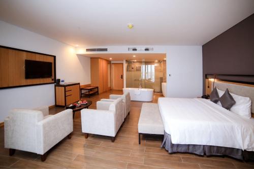 Ένα ή περισσότερα κρεβάτια σε δωμάτιο στο Dragon Style Hotel