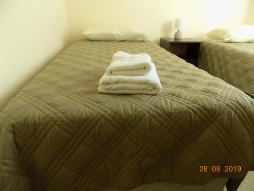 Säng eller sängar i ett rum på Hermoso departamento a pasos de avenida del mar