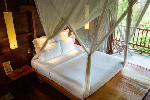 Ένα ή περισσότερα κρεβάτια σε δωμάτιο στο The Trang Villas