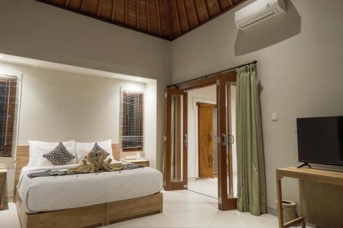 Katil atau katil-katil dalam bilik di Masia Villa Ubud