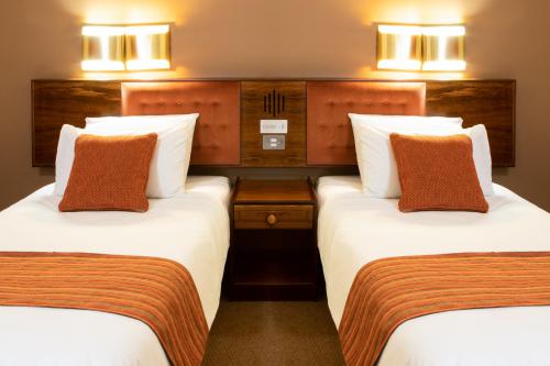 Postel nebo postele na pokoji v ubytování Elgro Hotel Potchefstroom