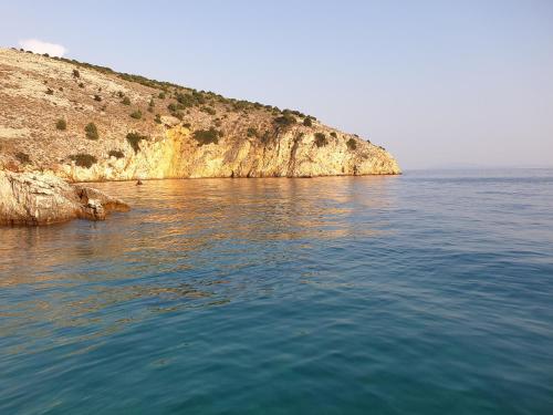 a large body of water next to a cliff at Villa Kvarner in Krk