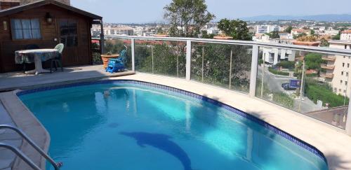 a swimming pool on the balcony of a house at Joli studio in Saint-Raphaël