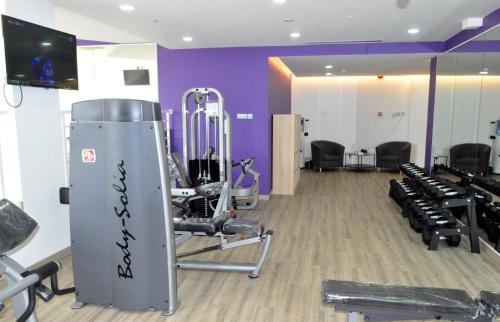 a gym with a bunch of exercise equipment in it at Mulia Hotel in Bandar Seri Begawan