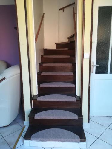 a set of stairs in a room with a door at Peace in Corbeil-Essonnes
