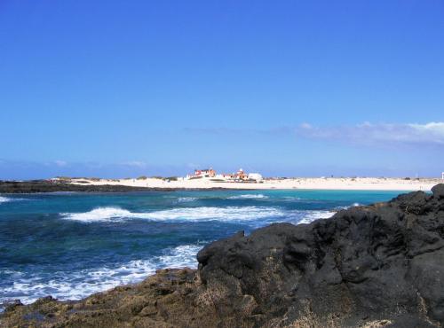 a view of the beach from the rocks at Casa Mate Cotillo Mar in El Cotillo