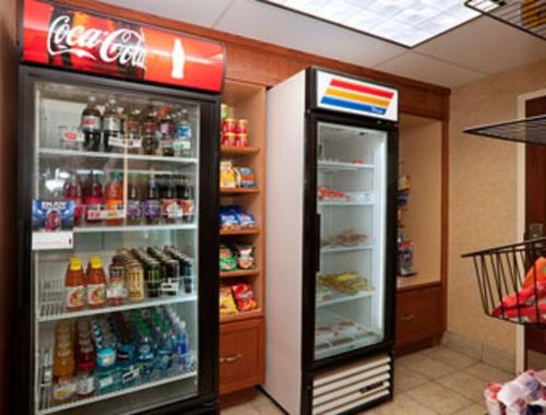 two refrigerators in a store with drinks and food at Baymont by Wyndham Elkhart in Elkhart