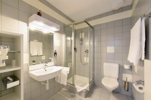 Koupelna v ubytování Hôtel des Mosaiques