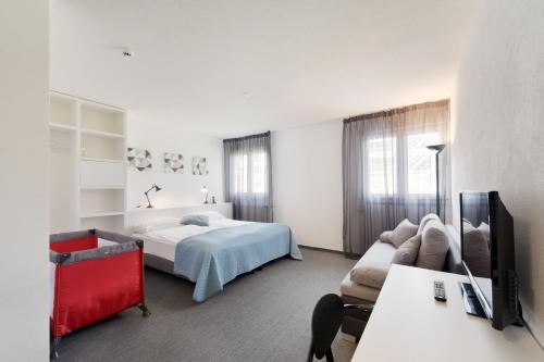 Postel nebo postele na pokoji v ubytování Hôtel des Mosaiques