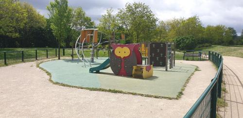 a playground in a park with a monkeycartoon at La magie de Disney in Bailly-Romainvilliers