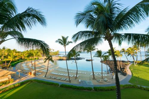 an aerial view of a resort with palm trees and the ocean at Fairmont Orchid in Waikoloa