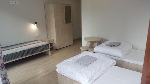 Postel nebo postele na pokoji v ubytování Dom Gościnny Marysieńka