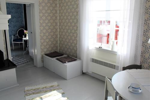 a white room with a table and a window at STF Hostel Vilhelmina Kyrkstad in Vilhelmina