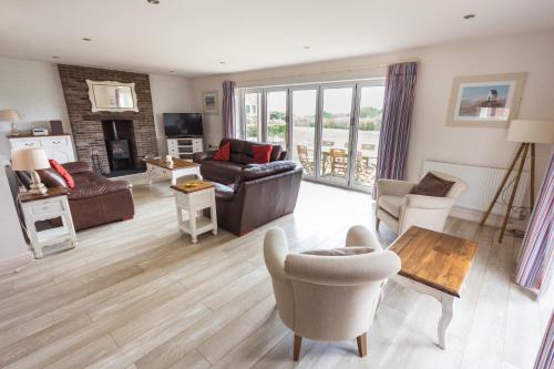 a living room with a couch and a table at The Bay Filey in Filey