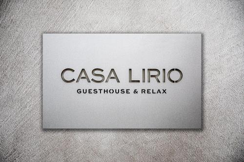 a sign for a casa lirico guest house and relax at Casa Lirio in Barcelona