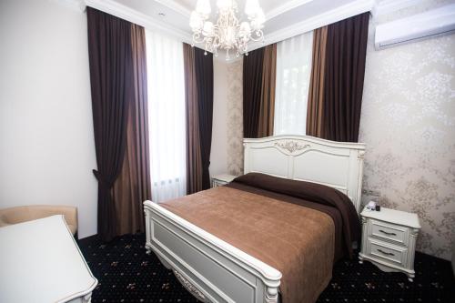 Готель Петрівський tesisinde bir odada yatak veya yataklar