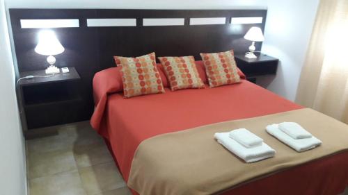 Кровать или кровати в номере Dpto Horneros