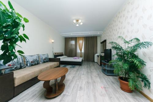 a living room with a couch and a table at Apartment 13А Holosiivska Street in Kyiv