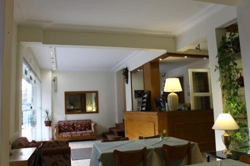a living room with a table and a chair at Apolo Atlantis in Mar del Plata
