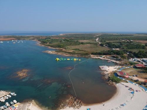 an aerial view of a beach with boats in the water at Apartment Stanko in Ližnjan