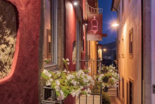 a street with flowers on the side of a building at Hostel Bulwark in Valença