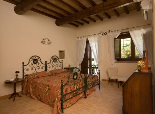 Postel nebo postele na pokoji v ubytování Agriturismo Poggio del Bolognino