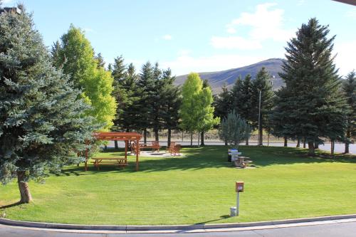 a park with a picnic table and a pavilion at The Inn at Tomichi Village in Gunnison