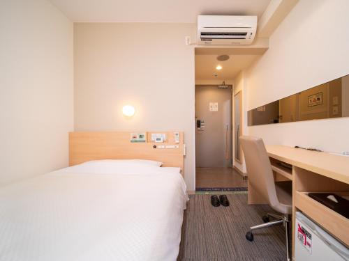 Postel nebo postele na pokoji v ubytování Super Hotel Asakusa