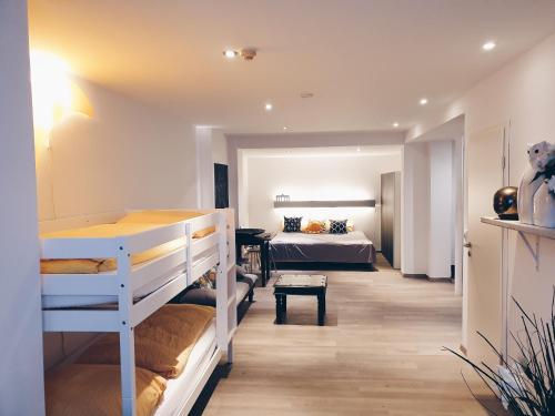 a room with two bunk beds and a bedroom at Ford Apartment Bremen City Center in Bremen