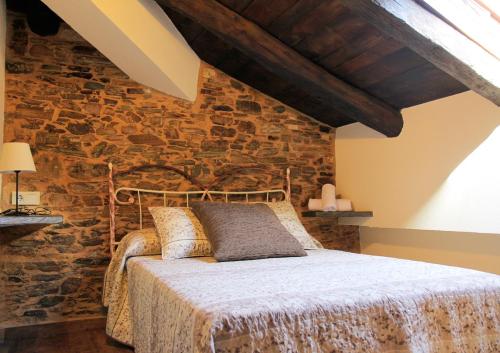 En eller flere senge i et værelse på Casa da Lembranza