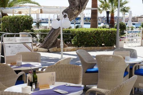 a large bird sitting on top of a table at Hotel Miramar in Port de Pollensa