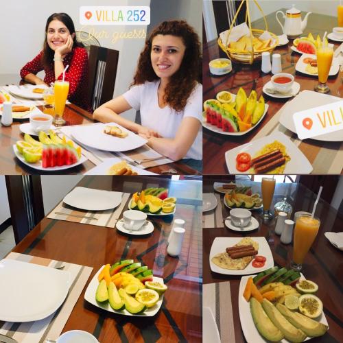 two women sitting at a table with plates of food at Villa 252 Kosgoda in Kosgoda