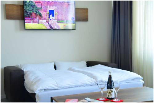 Katil atau katil-katil dalam bilik di Motel Plus Schönefeld