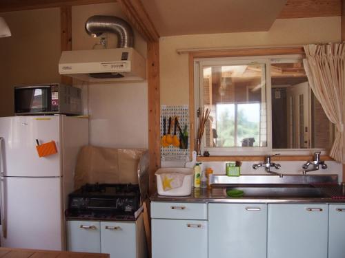 Kuchyň nebo kuchyňský kout v ubytování Kumamoto Guesthouse Minami Aso Little Asia