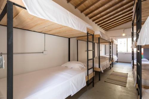 Una cama o camas en una habitación de Gastón Coliving