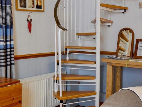 A bunk bed or bunk beds in a room at Pebbles 