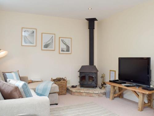 A television and/or entertainment center at Gardeners Cottage 