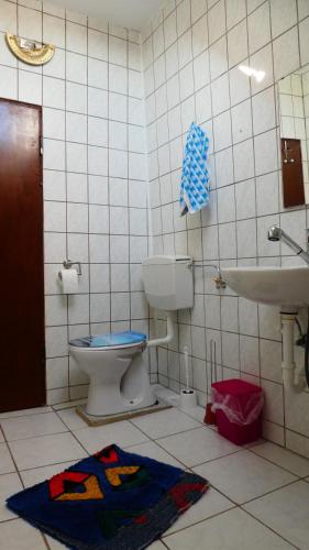 a bathroom with a toilet and a sink at FerienHaus Elim in Morbach