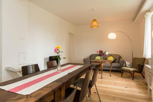 a living room with a table and a couch at Gutshaus Lexow in Lexow