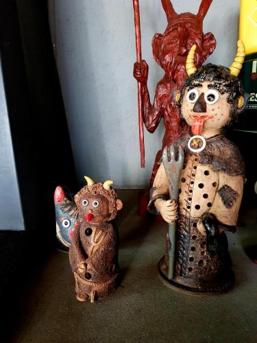 two ceramic figurines of a devil and a teddy bear at Čertovka Peklo in Náchod