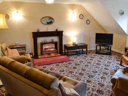 A seating area at Coachmans Cottage 