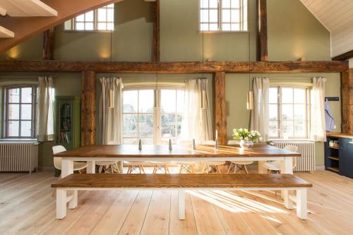 a large dining room with a table and chairs at Gutshaus Lexow in Lexow