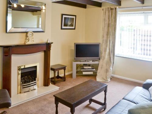 A television and/or entertainment center at Lobster Cottage 