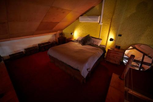 a bedroom with a large bed in a room at Central City Warehouse Apartment in Melbourne