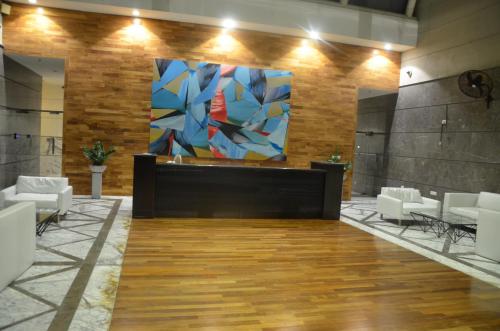 a lobby with a large painting on the wall at Atrium - ICONIC APARTMENT in Sri Jayewardenepura Kotte