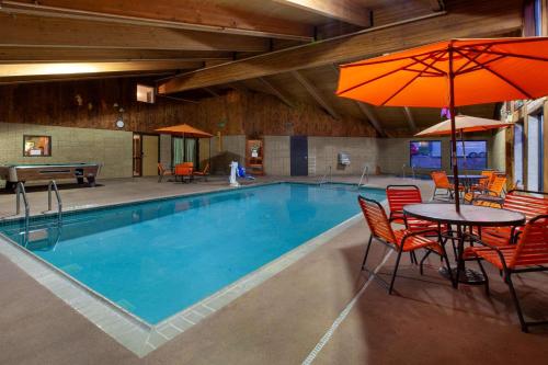 The swimming pool at or close to AmericInn by Wyndham Iron River