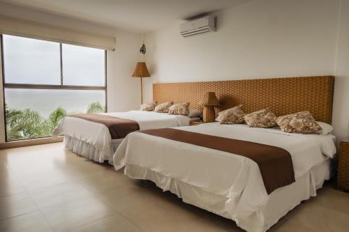 Кровать или кровати в номере Hotel Vistalmar